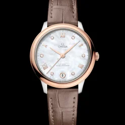 34 mm, acciaio‑oro Sedna™ su cinturino di pelle