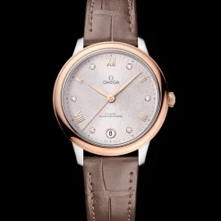 34 mm, acciaio‑oro Sedna™ su cinturino di pelle
