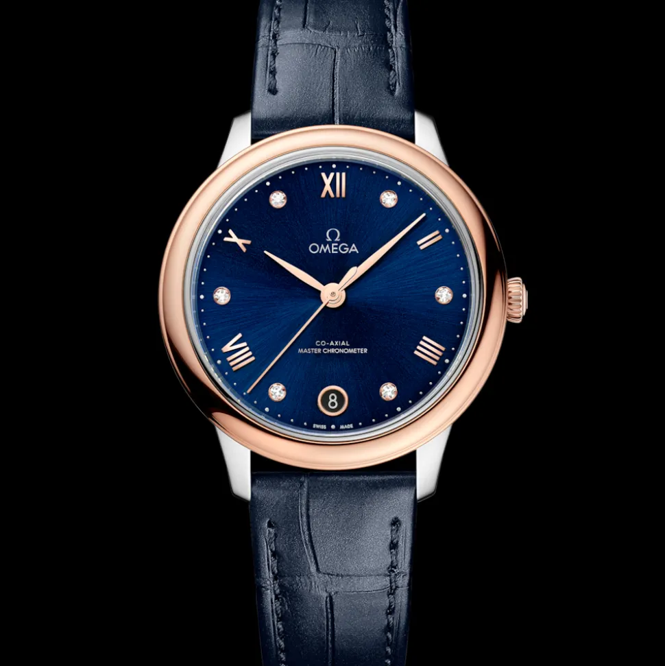 34 mm, acciaio‑oro Sedna™ su cinturino di pelle
