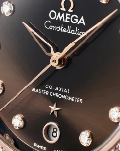 36 mm, acciaio‑oro Sedna™ su cinturino di pelle