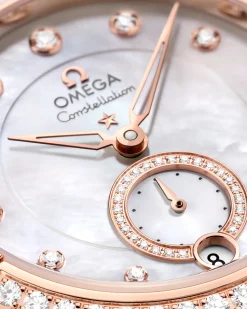 34 mm, acciaio‑oro Sedna™ su cinturino di pelle