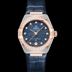29 mm, acciaio‑oro Sedna™ su cinturino di pelle