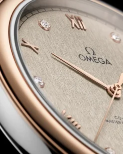 40 mm, acciaio‑oro Sedna™ su cinturino di pelle