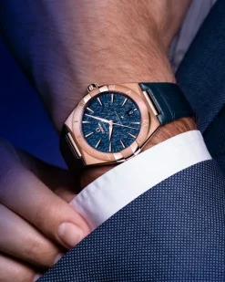 39 mm, oro Sedna™ su cinturino di pelle